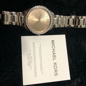 Michael Kors  woman’s Layton three-hand stainless steal watch